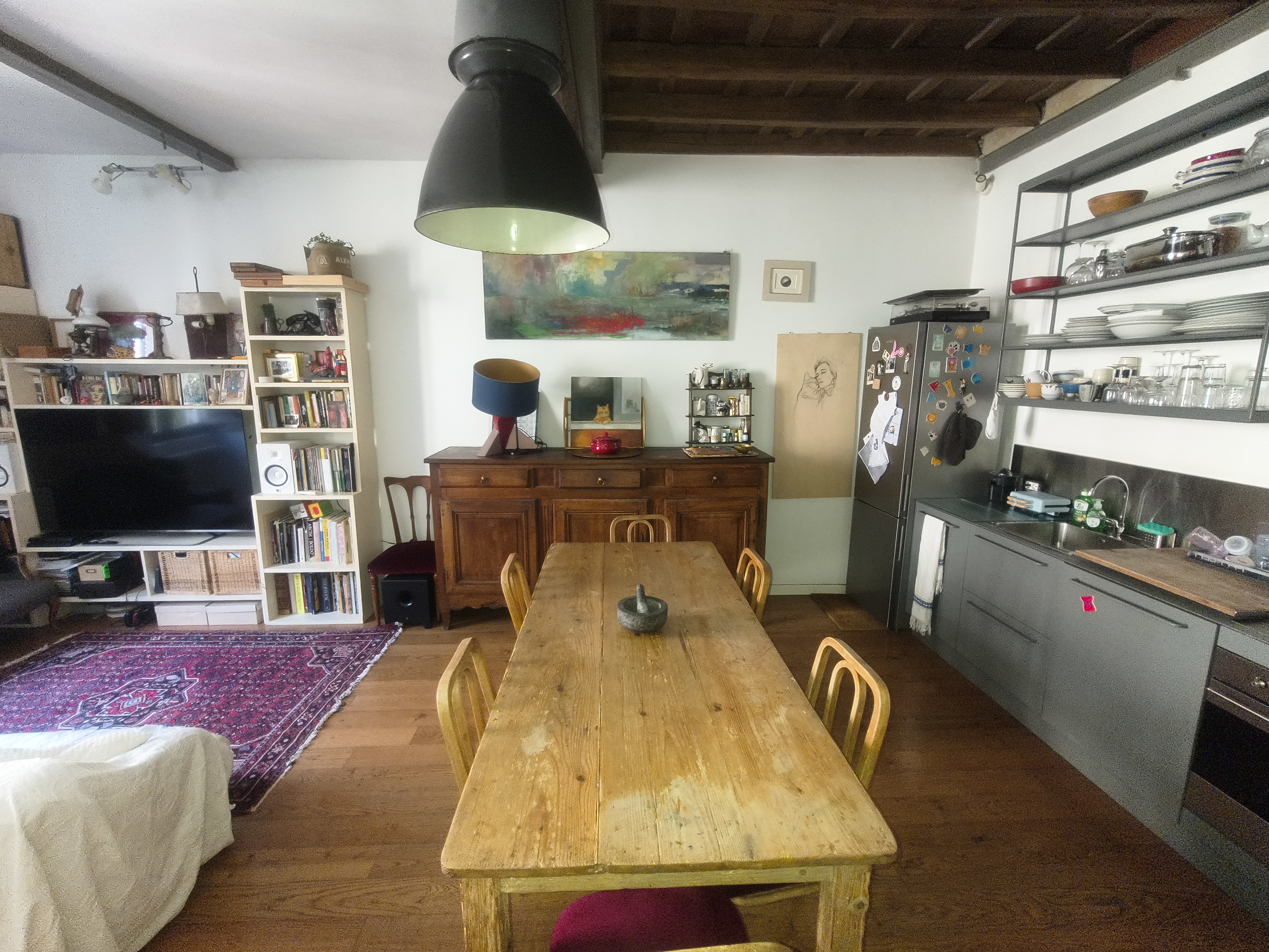 The living room with open kitchen