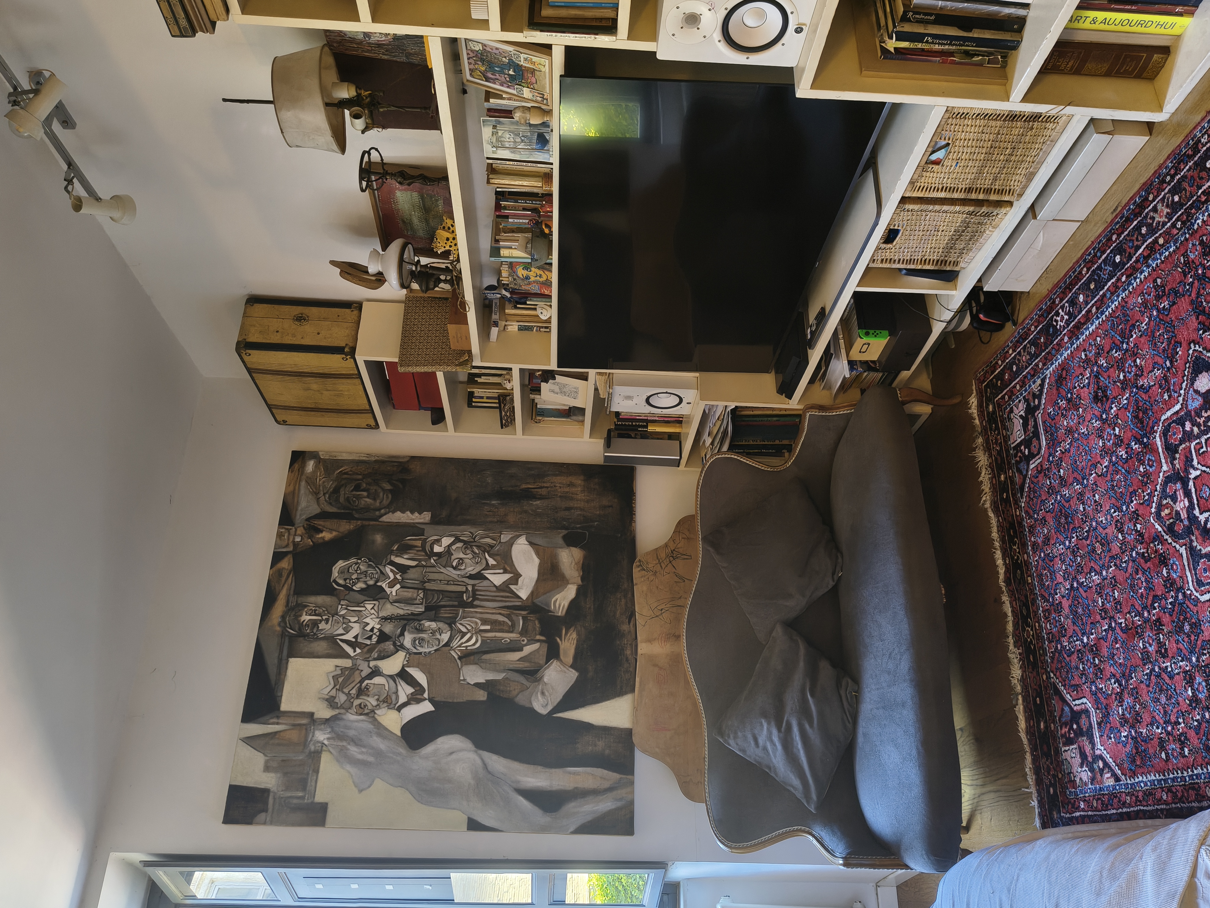 The living room from above, with sofa and bookshelves